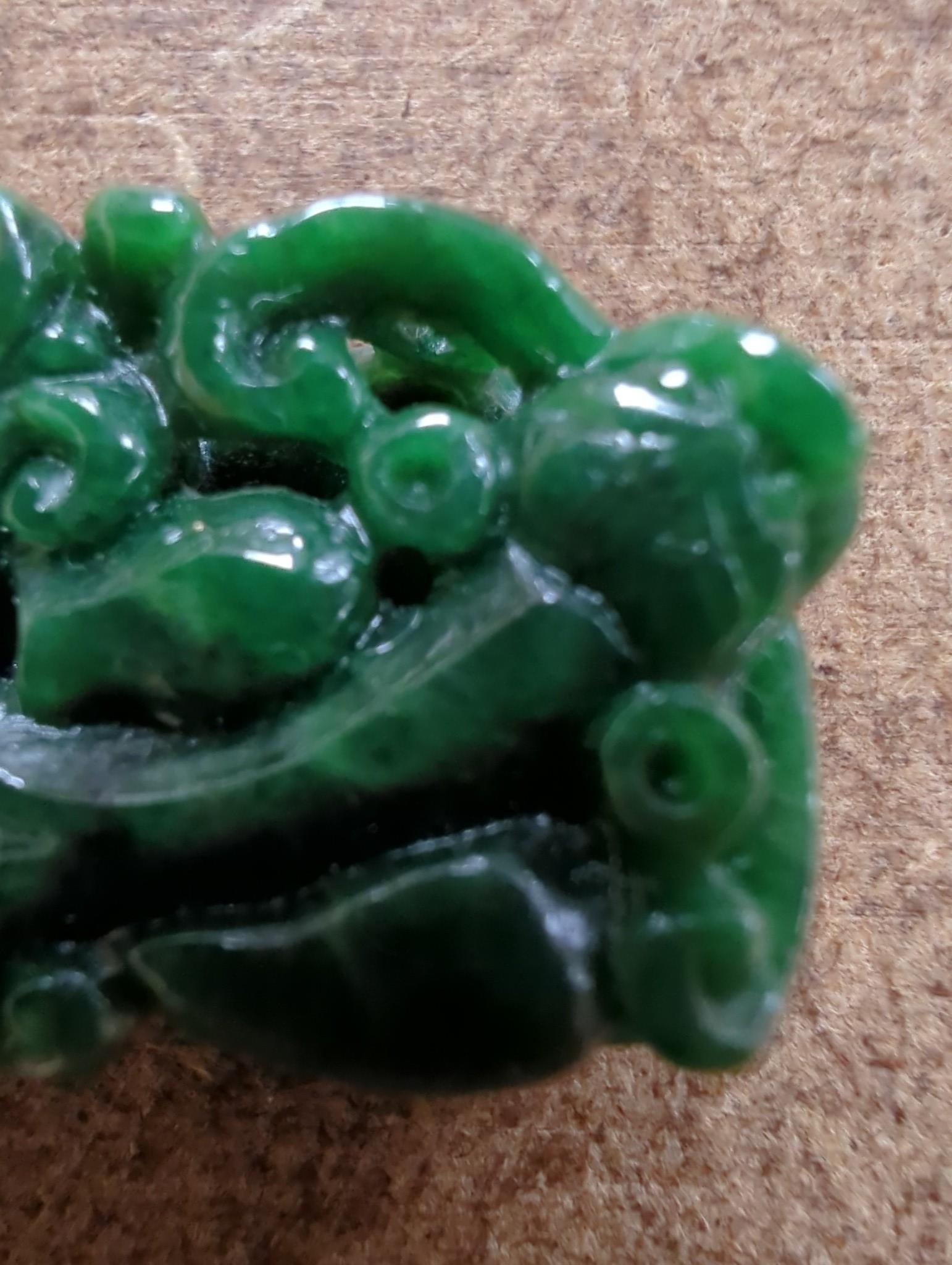 A Chinese Jadeite carving of two cash and a chilong, 3.7cm